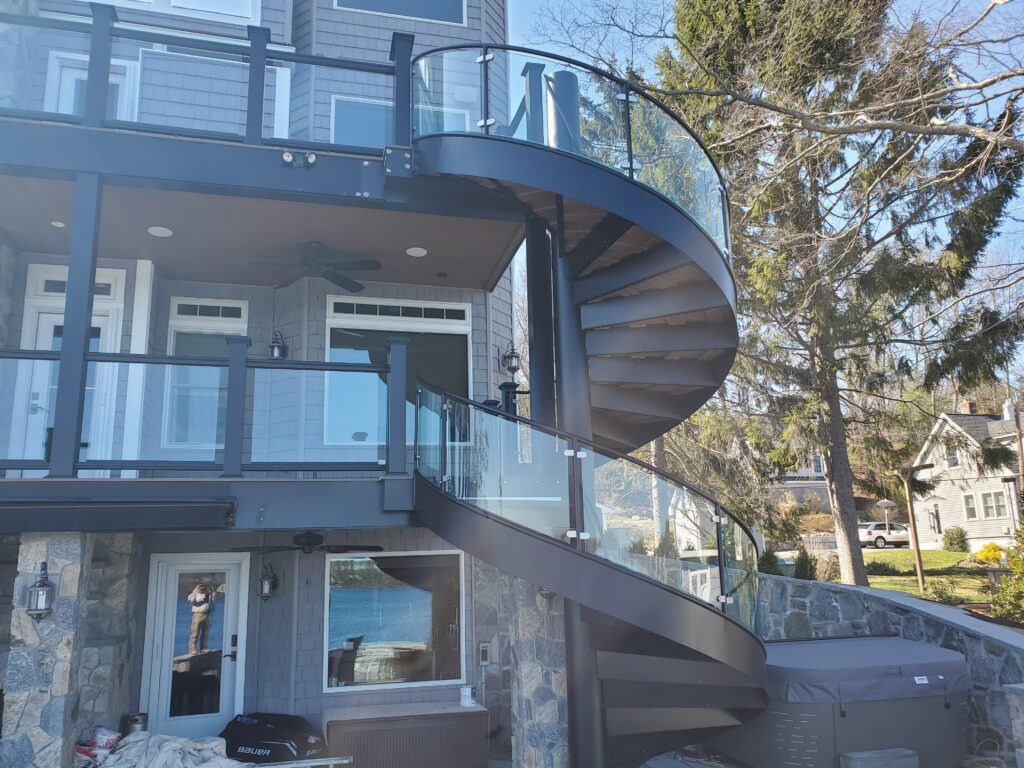 Monumental Spiral Stair With Glass Railing and Flat Plate Stringer 